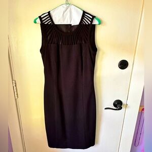 Calvin Klein LBD with open vent in back and open detail on neckline